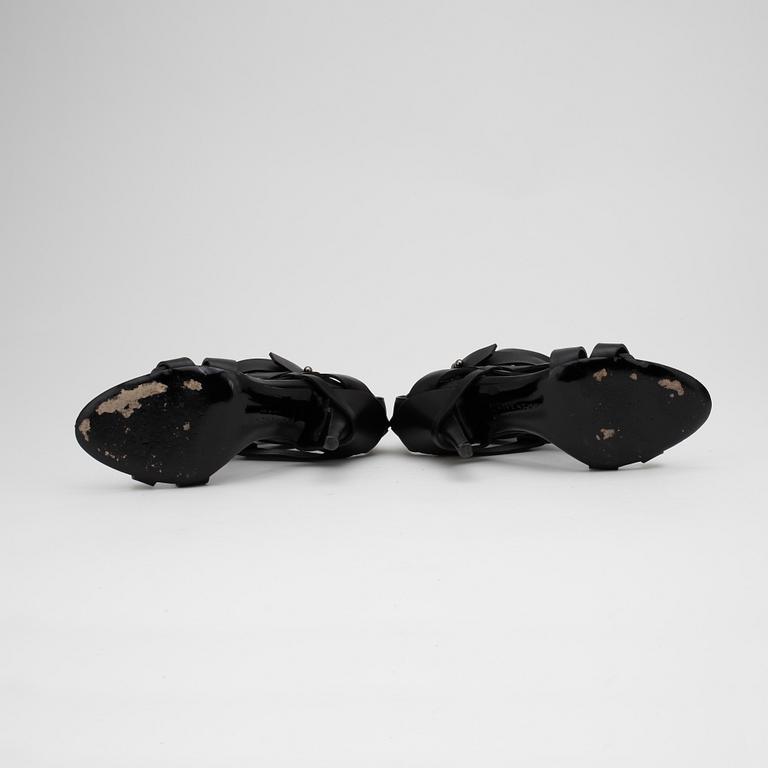 GIVENCHY, a pair of sandalettes with black leather straps.