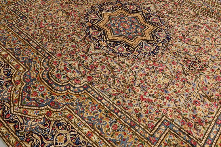 A Kirman Laver carpet, 'Millefleur', approx. 410 x 296 cm.