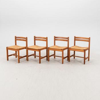 A set of four 1970s pine chairs.