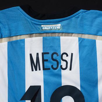 A football shirt, signed by Lionel Messi.