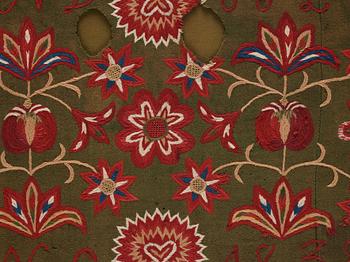 An embroidered carriage cushion, ca 51 x 113 cm (with mounting 61 x 122 cm) signed and dated END JPLG ANO 1838, Scania.