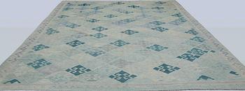 A Kilim carpet, c. 392 x 294 cm.