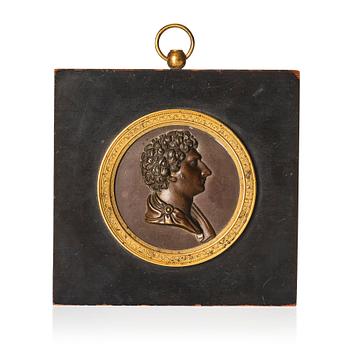 125. A Swedish Empire ormolu and patinated bronze portrait medallion depicting Karl XIV Johan, early 19th Century.