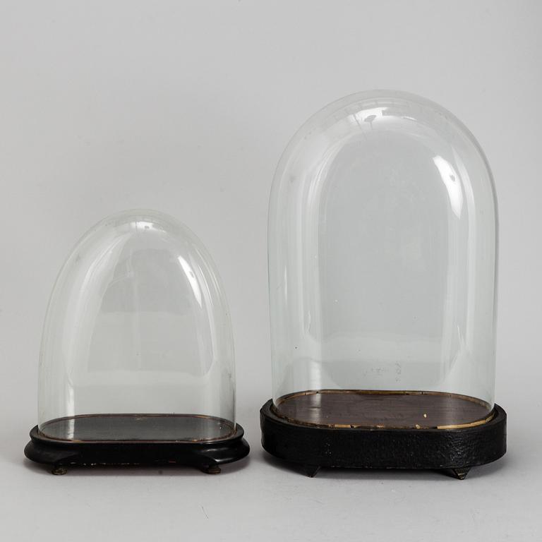 Two glass hoods, circa 1900.