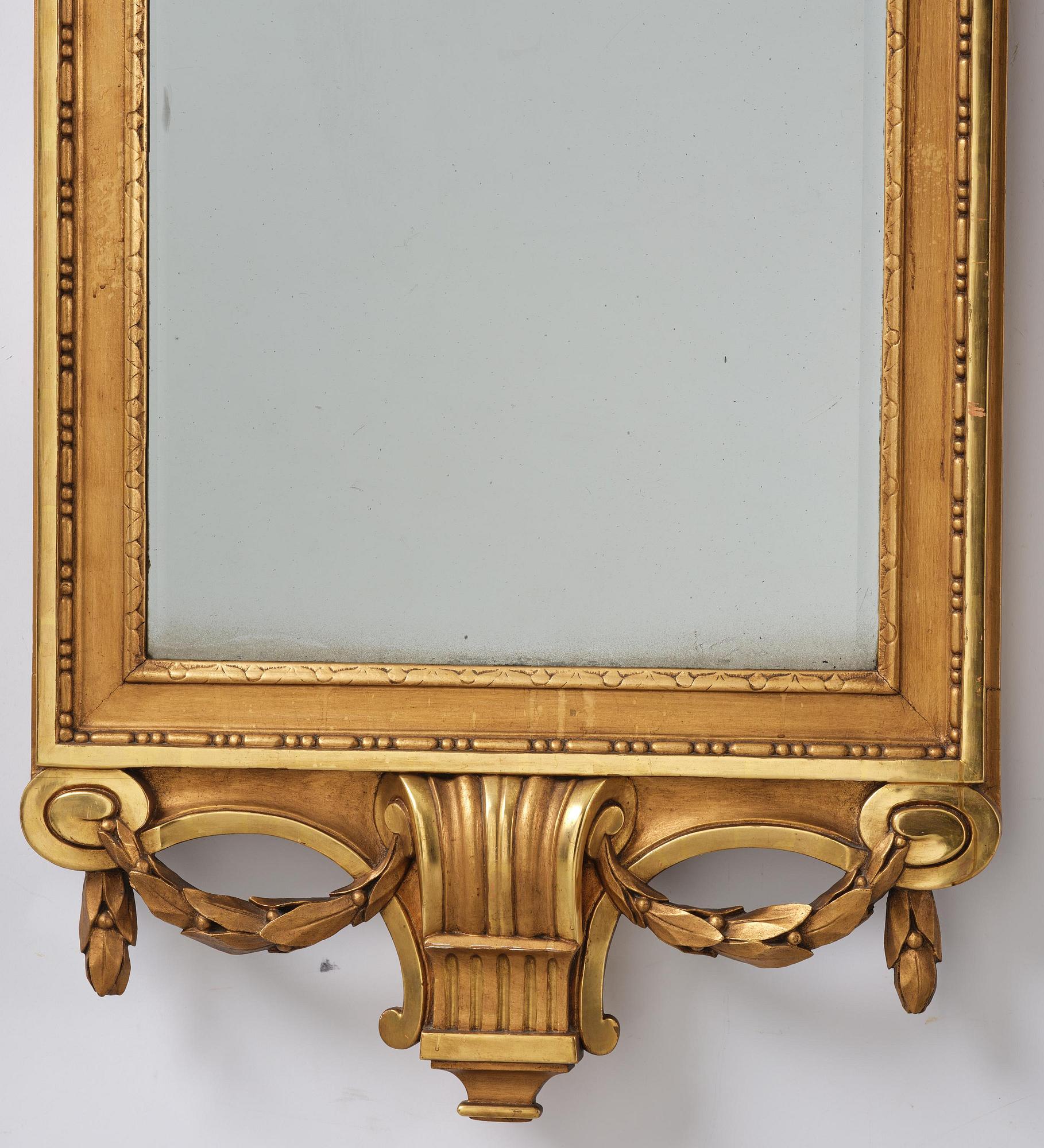 A Gustavian giltwood mirror, Stockholm, late 18th century.