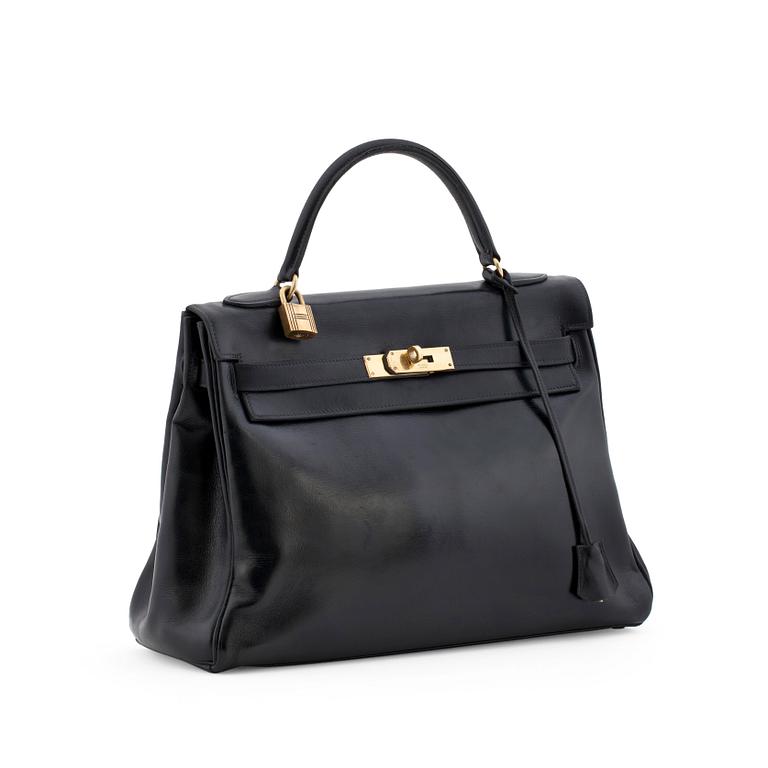 HERMÈS, a box black "Kelly 32" bag, before 1960.