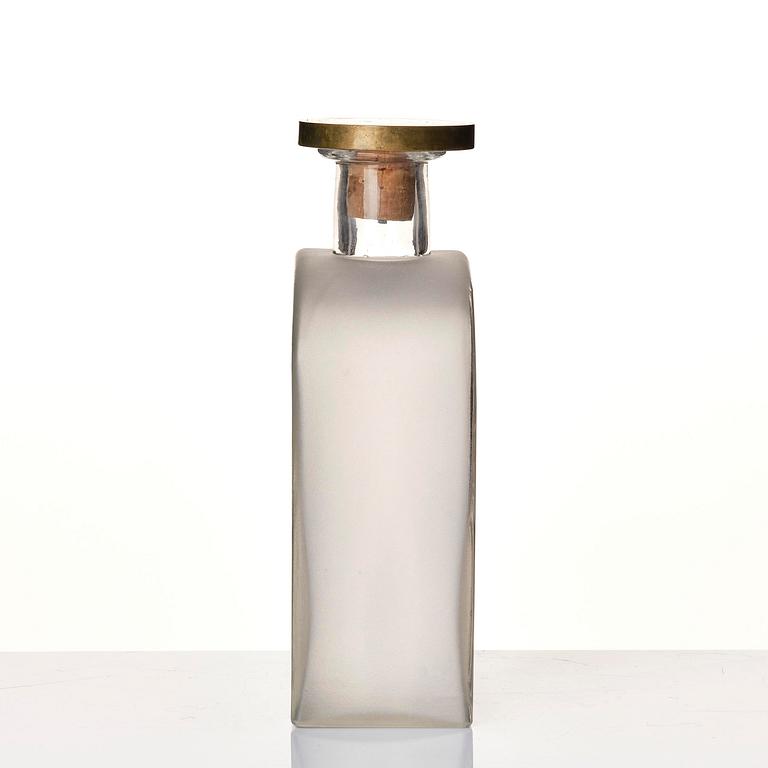 Firma Svenskt Tenn, a glass bottle model A 1608, with a pewter and brass stopper by Björn Trägårdh, Stockholm, 1930s.