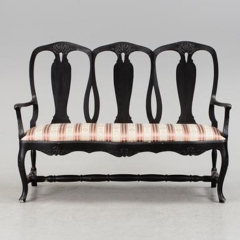 A mid 1900s rococo style sofa.