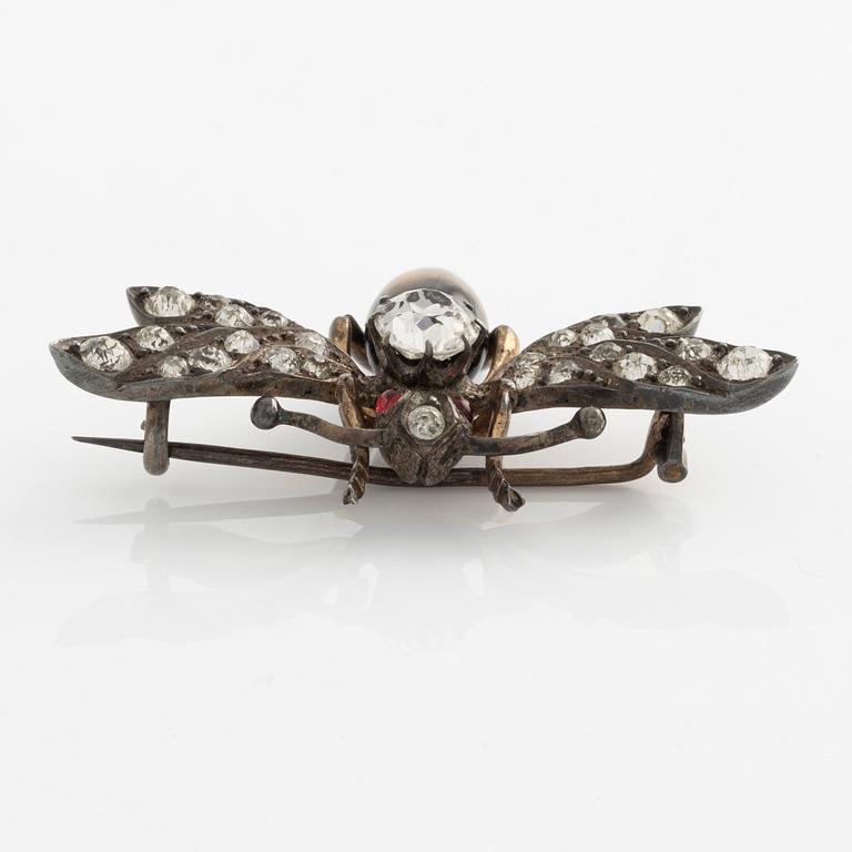 Brooch with white paste stones and tiger's eye.