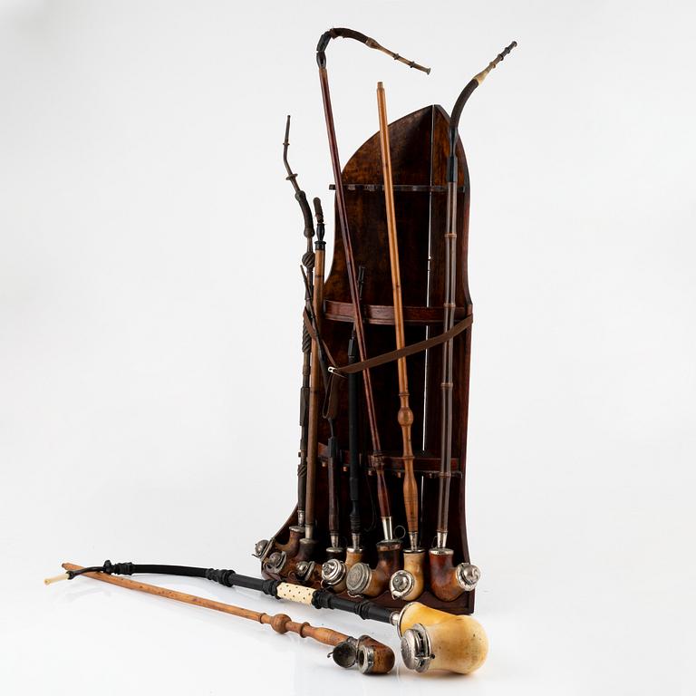 Pipe stand and nine pipes, 19th/20th century.