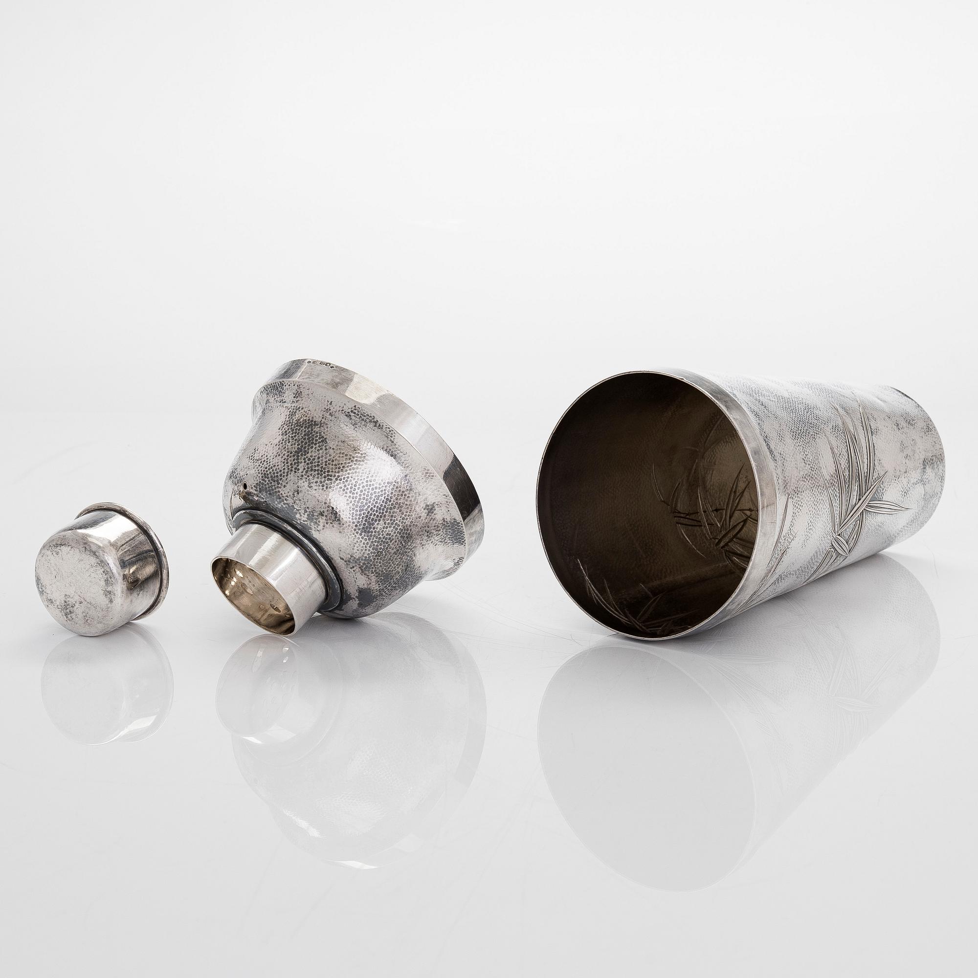 A silver cocktail shaker with strainer, Japan, first half of the 20th century.