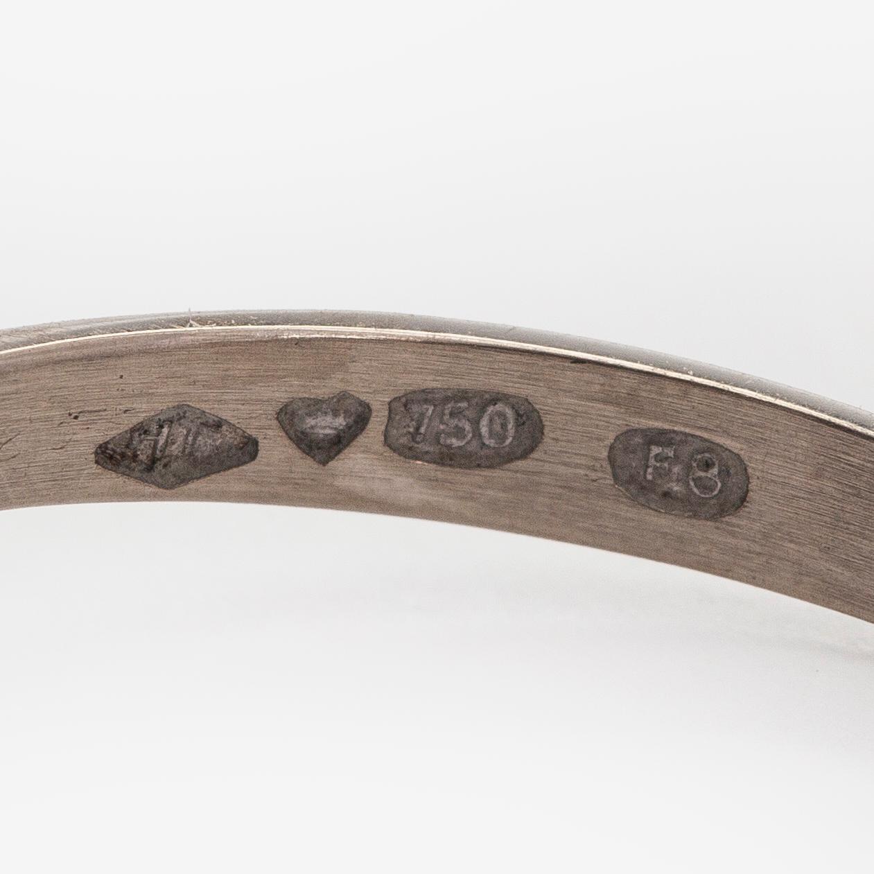 A. Tillander, ring, faceted sapphire, brilliant cut diamonds, 18K white gold, Helsinki 1983.