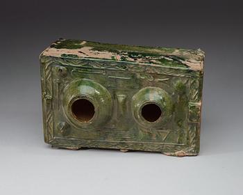 A green glazed pottery model of a stove, Han dynasty  (206 BC– AD 220).