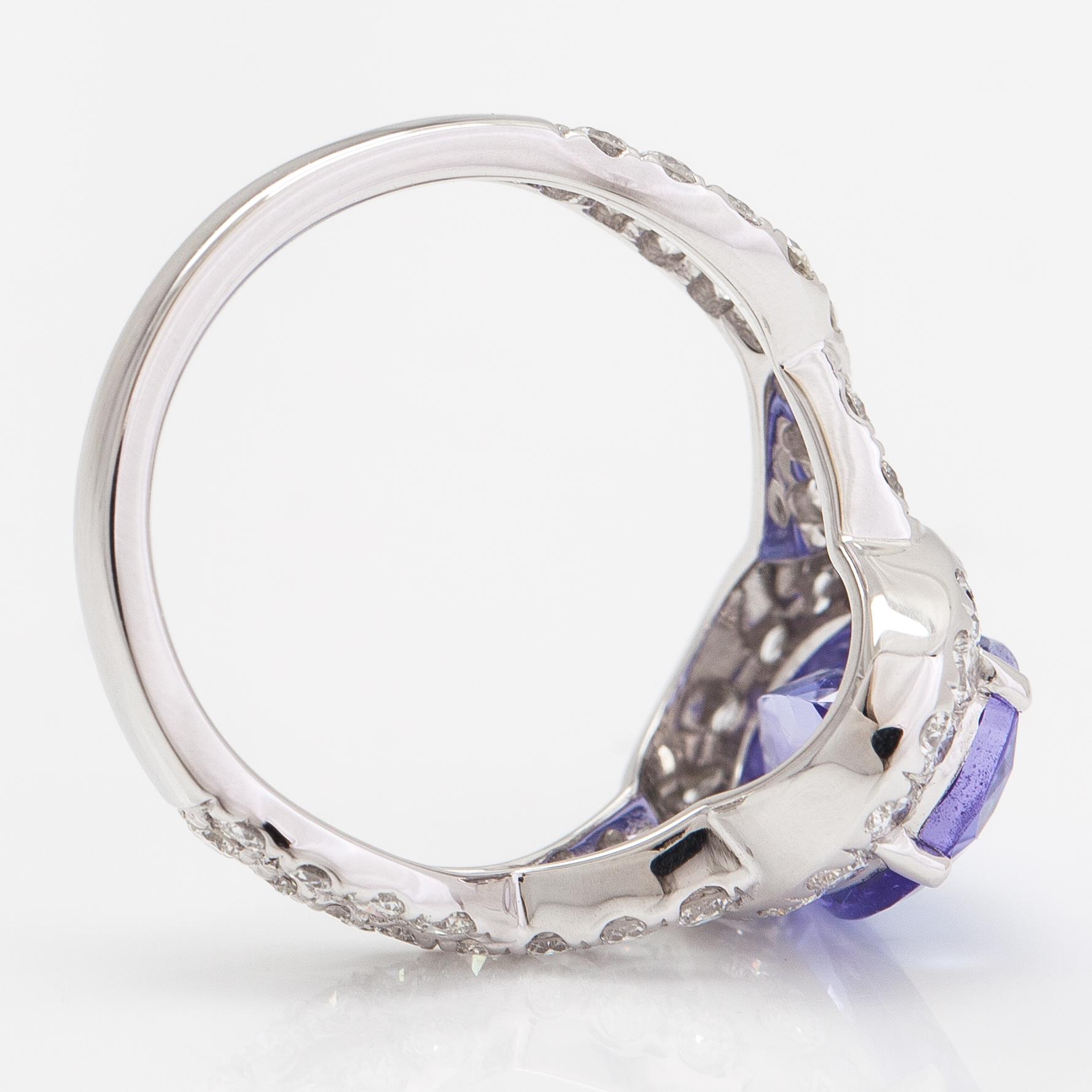An 18K white gold ring with a ca. 3.45 ct tanzanite and diamonds ca 1.53 ct in total. IGI certificate.