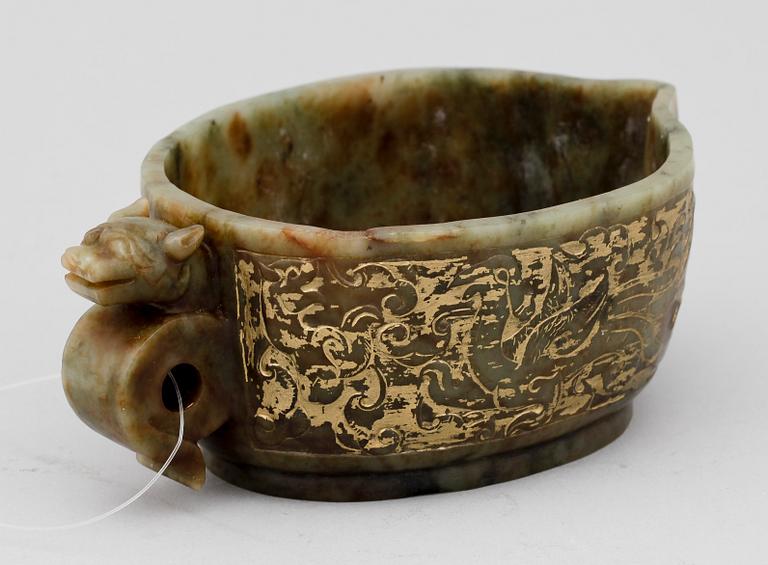 An archaistic carved and gilded vessel, Qing dynasty.