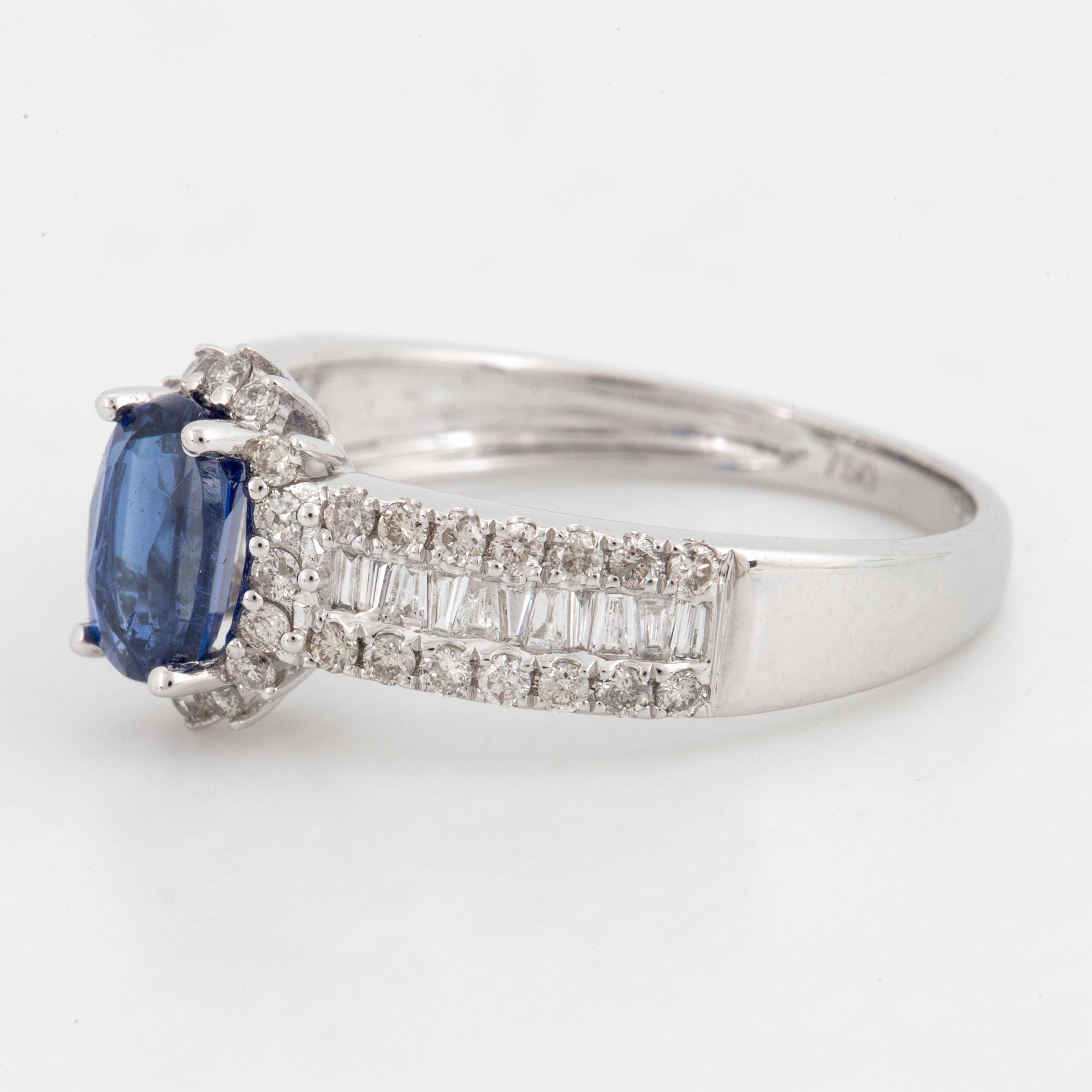 Kyanite and brilliant-cut diamond ring.