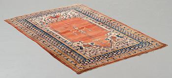 A rug, an antique silk Heriz, ca 166,5-170 cm x 116-120 cm.