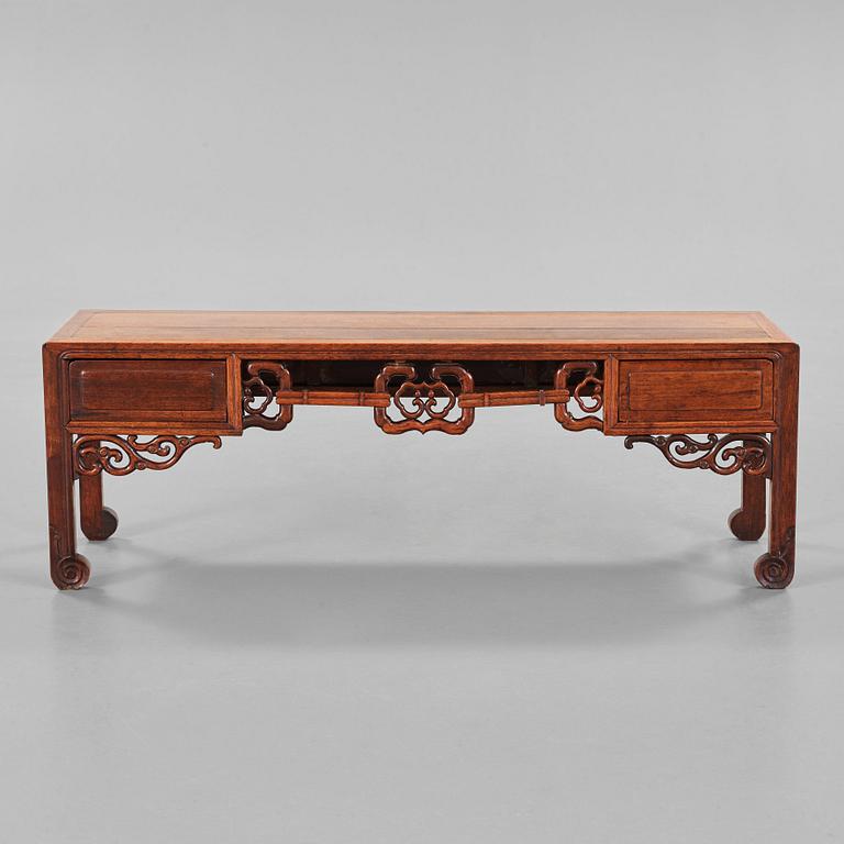 A Chinese hardwood low table, early 20th Century.