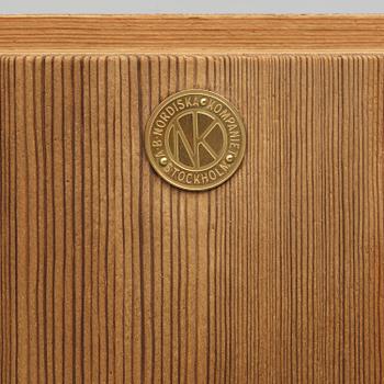 Axel Einar Hjorth, a stained pine "Sandhamn" corner cabinet, Nordiska Kompaniet, Sweden, 1931.