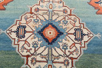 An oriental rug. Around 295 x 190 cm.