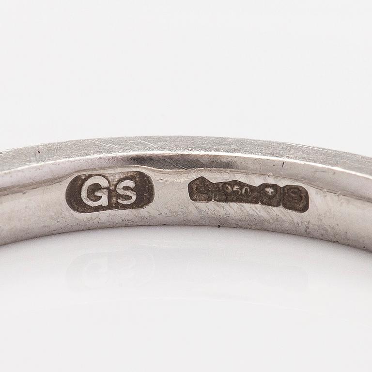 A platinum ring with brilliant cut diamonds.