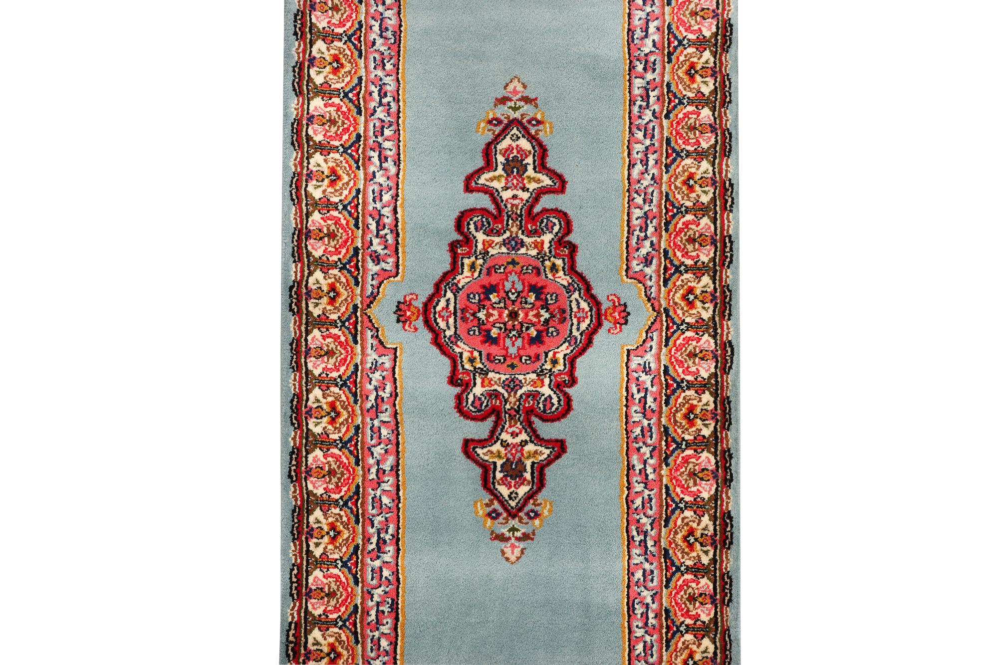 An oriental runner, c. 550 x 74 cm.