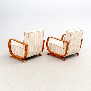 A pair of veneered Art Deco armchairs first half of the 20th century.