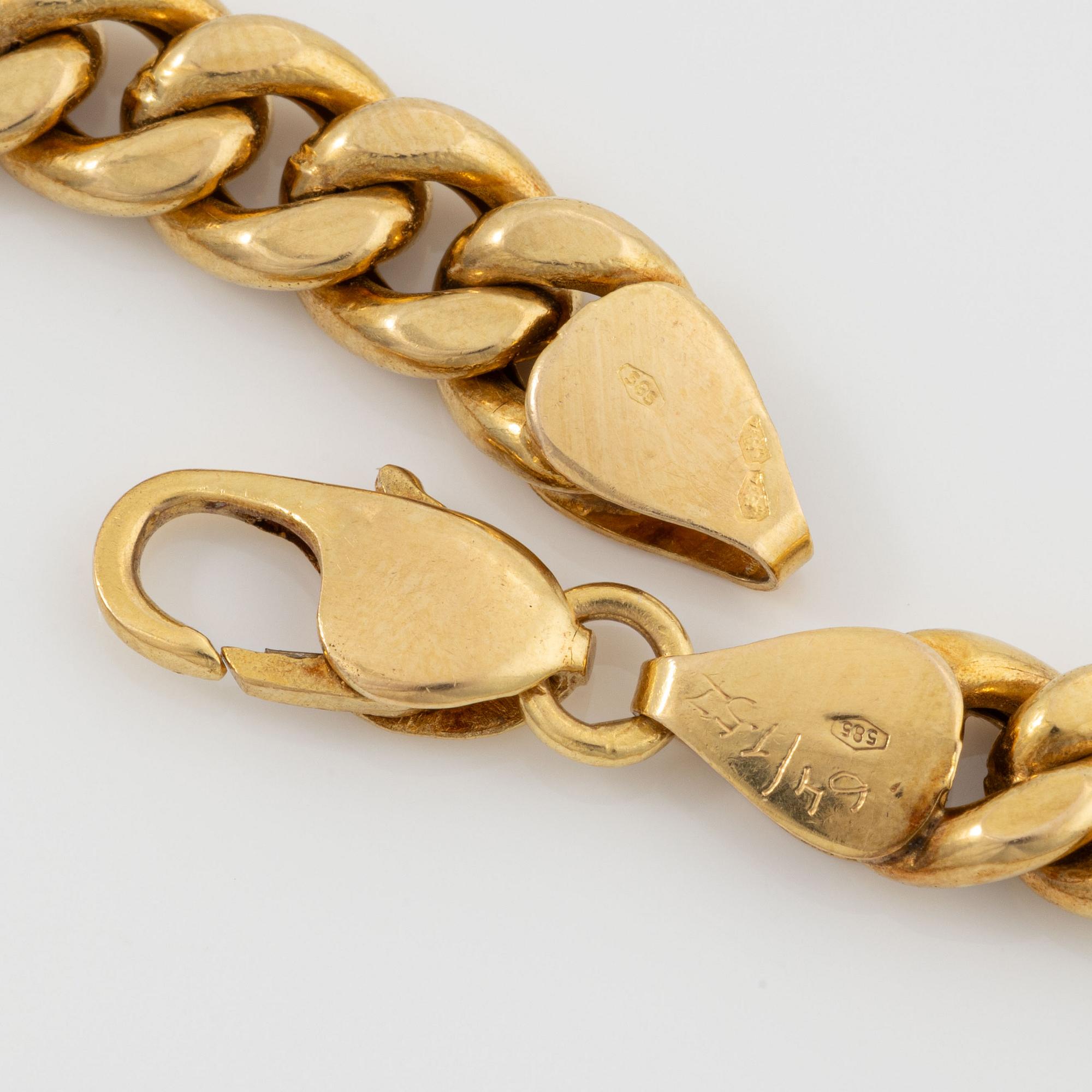 Necklace in 14K gold with faceted rubies and eight-cut diamonds.