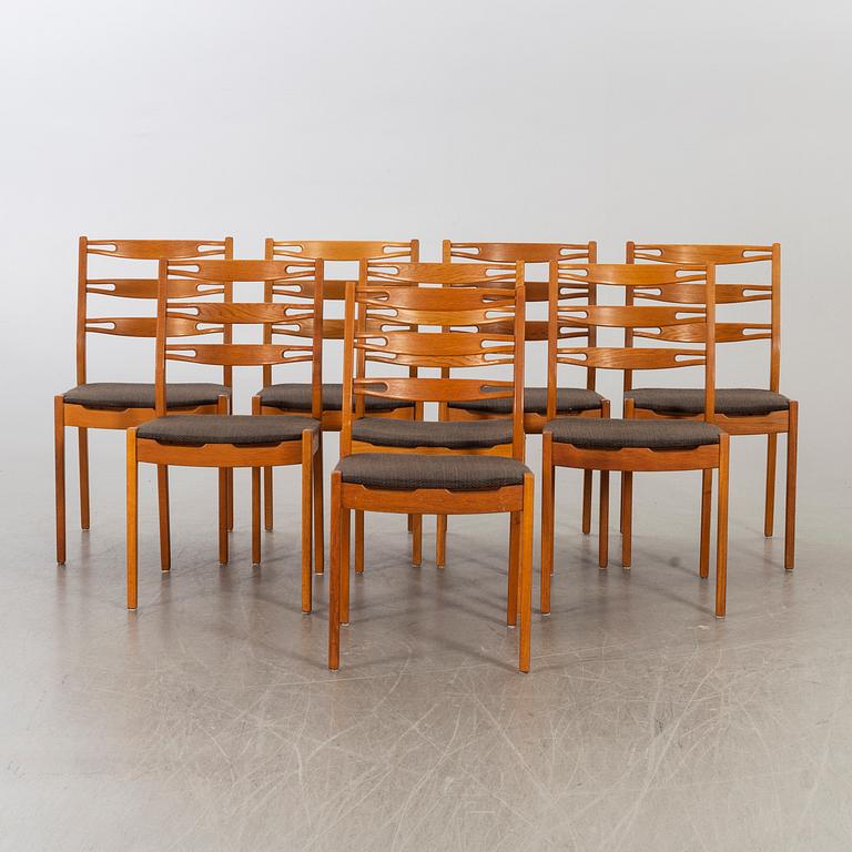 Eight 1960's oak chairs.