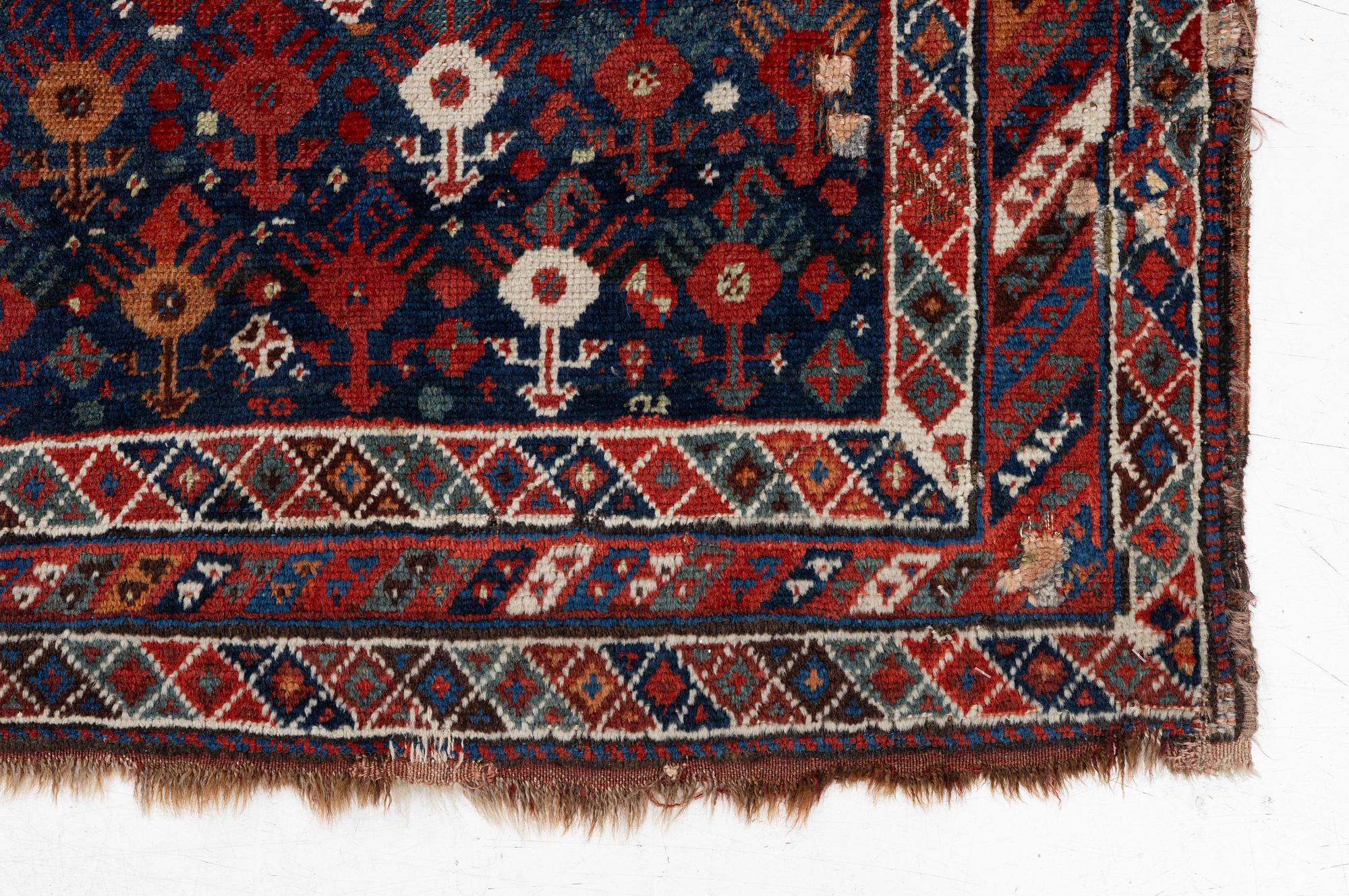 An antique Qashgai rug, 230 x 135 cm.