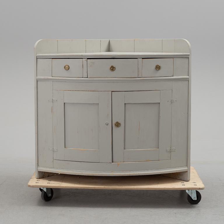 A mid 19th century corner sideboard.
