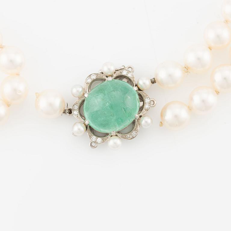 Pearl necklace, two pieces, cultured pearls, one with a clasp, Carlman, 18K white gold with cabochon-cut emerald and diamonds.