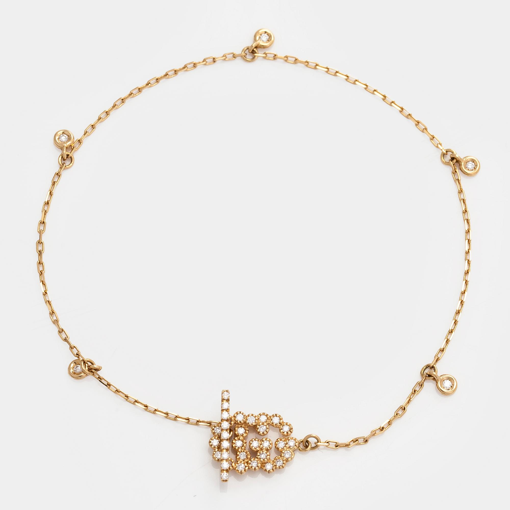 Gucci, armband, "Interlocking", 18K guld med briljantslipade diamanter.