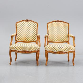 A pair of rococo style armchairs, early 20th Century.