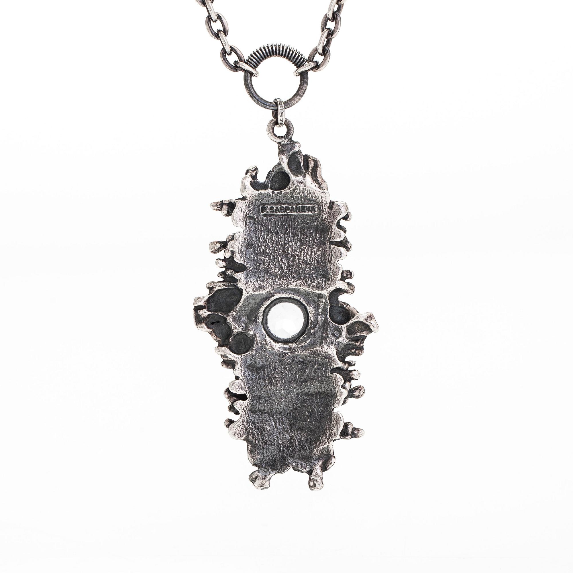 Pentti Sarpaneva, a silver and rock crystal necklace, ring and earrings, Turun Hopea, Turku.