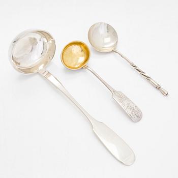 A silver and glass inkwell and eight pieces of silver cutlery, Latvia and Estonia, mid-19th century and 1924-44.