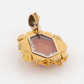 A 19th century 14K gold pendant with a hardstone cameo.