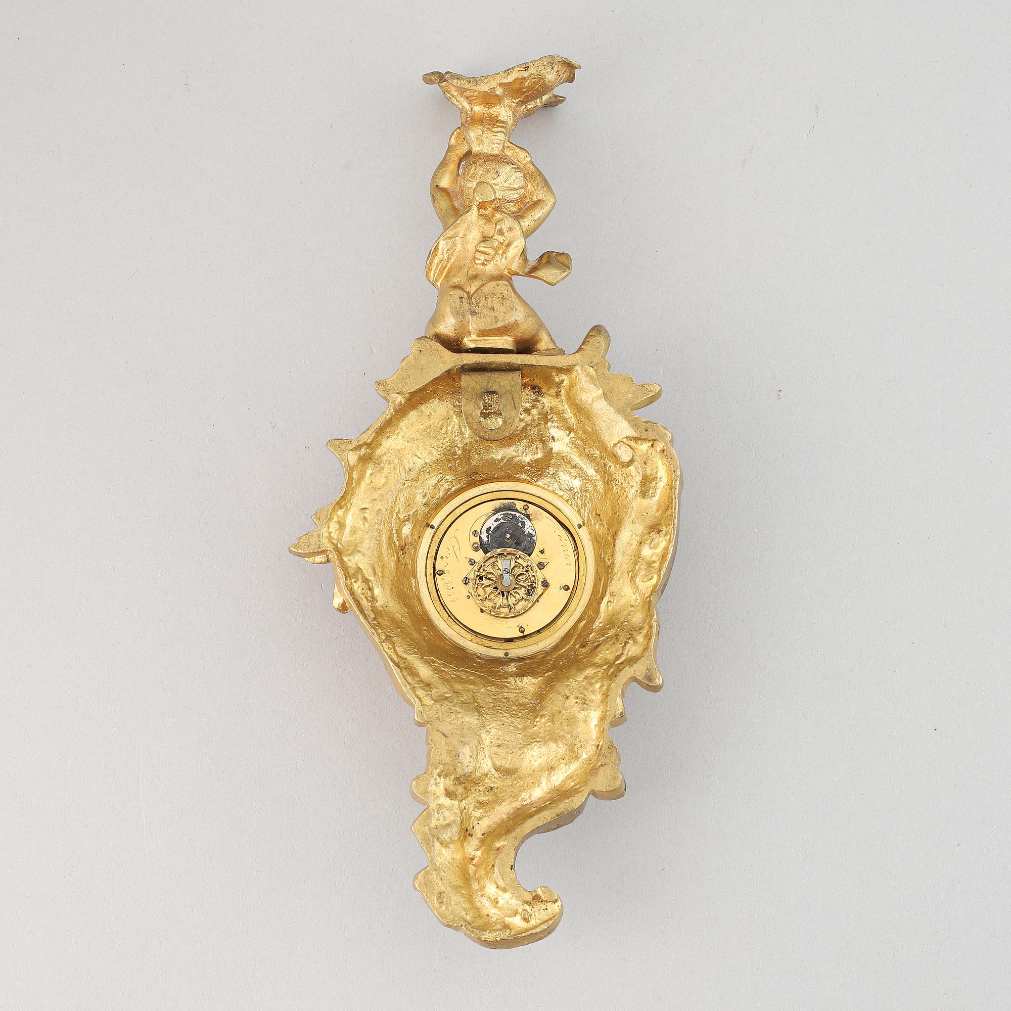 A late 19th century gilt bronze miniature wall clock, clock face signed Breguet a Paris.