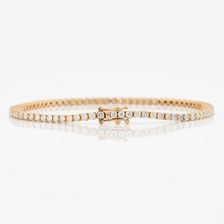 Tennisarmband 18K guld med briljantslipade diamanter.
