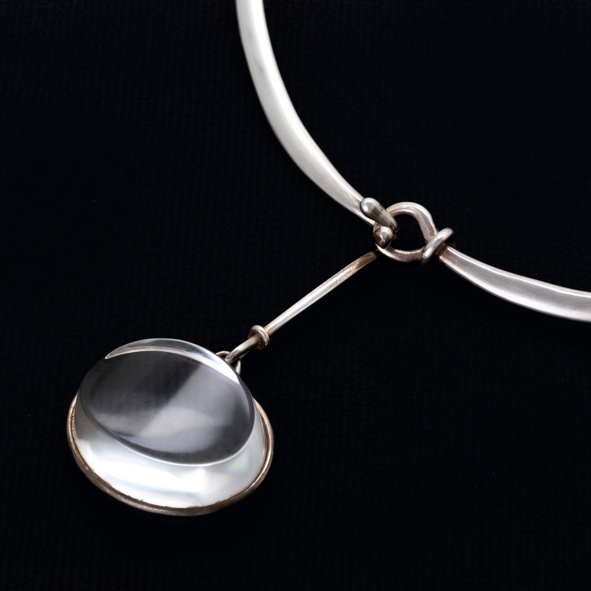 Vivianna Torun Bülow-Hübe. Necklace with pendant, sterling silver and rock crystal or glass.