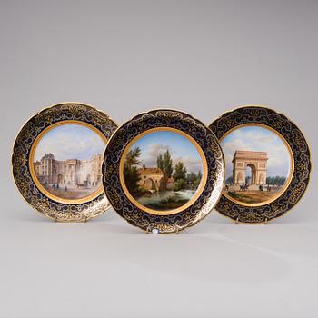 A set of 3 French porcelain decorative plates from the latter half of the 19th century.