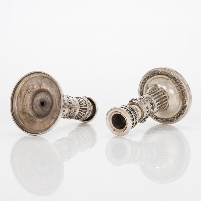 A pair of Saglier Frères silver plated Louis XVI-style candlesticks from around year 1900.