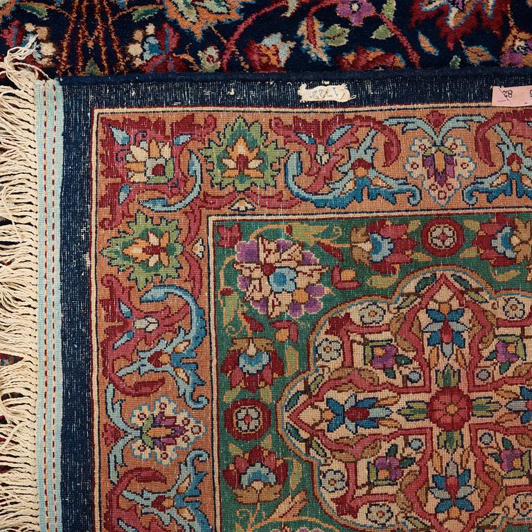 A CARPET. A semi-antique Kerman. 614,5 x 360,5 cm.