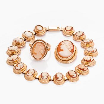 A 14K gold and shell cameo jewelry set, bracelet, pendant/brooch and ring.