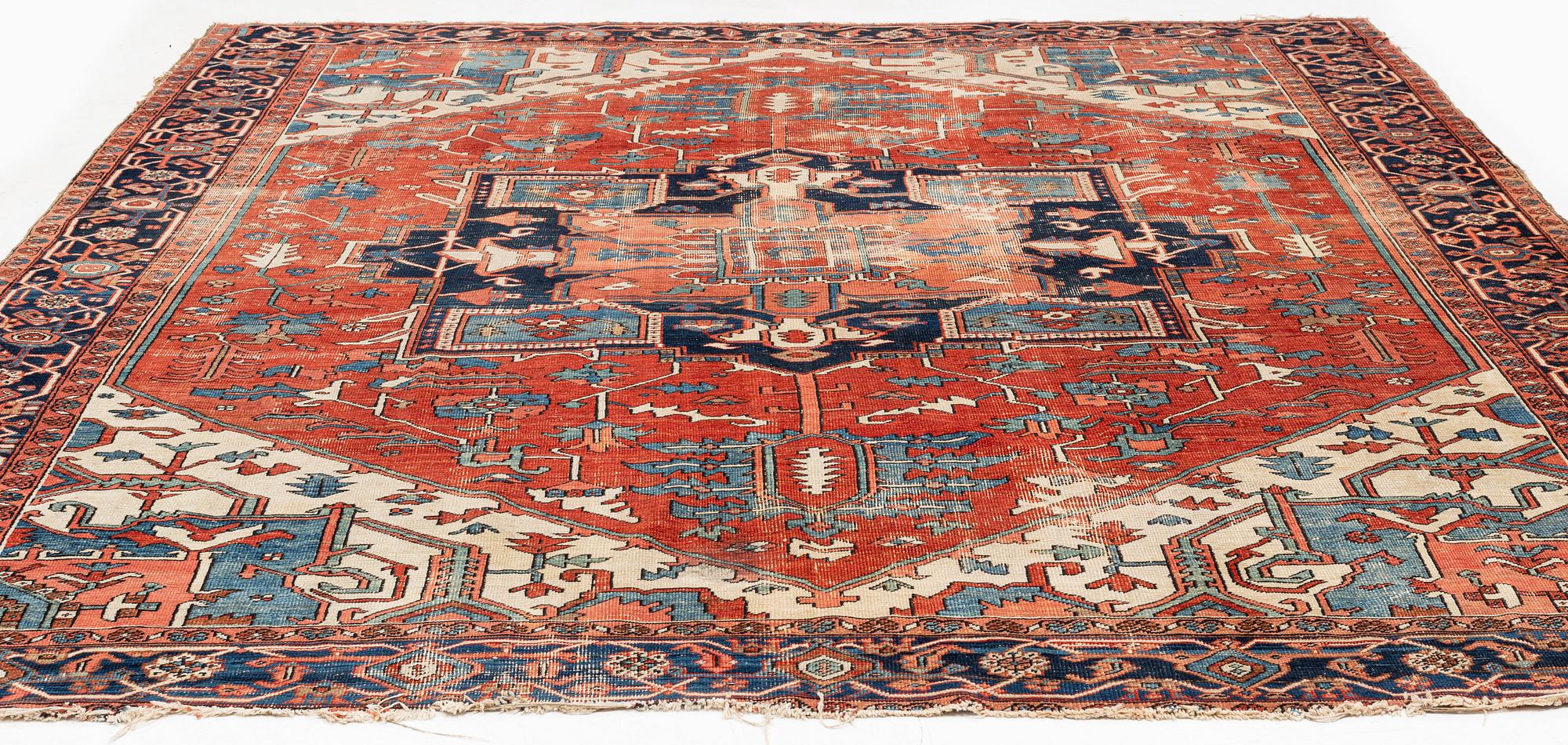 An antique Heriz carpet, ca 350 x 317 cm.