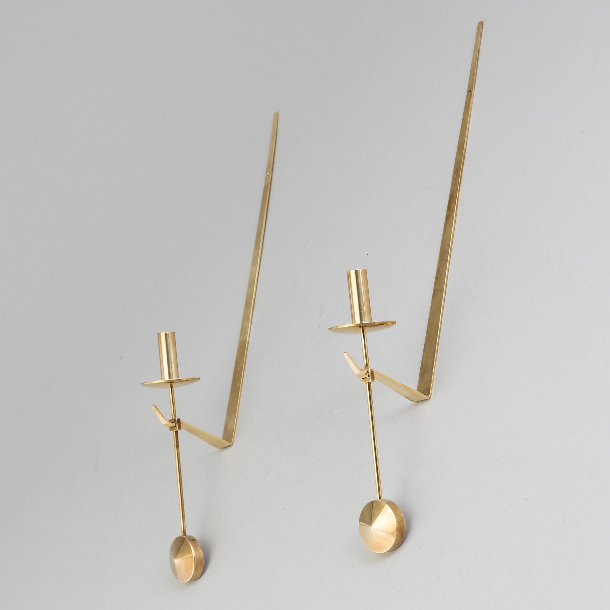 A pair of 20th century brass wall candleholders "Pendel" design Pierre Forssell for Skltuna, Sweden.