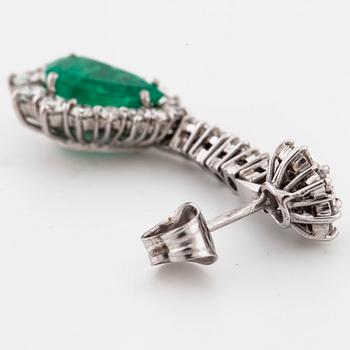 A pair of pear cut emerald and brilliant cut diamond earrings.