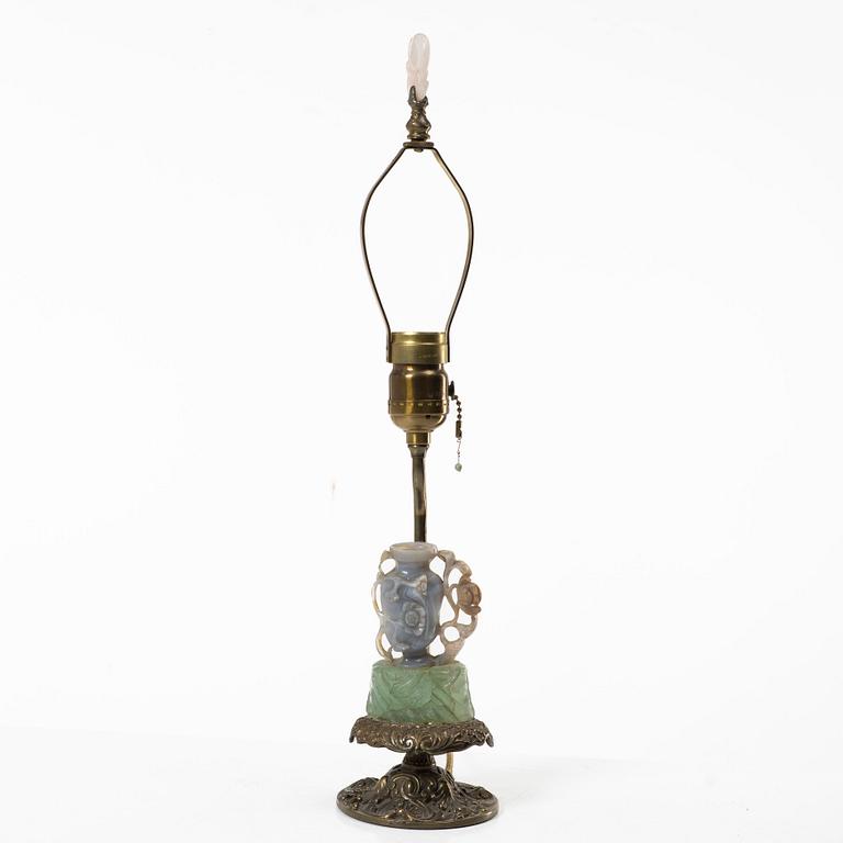 A Chinese table lamp with a carved stone vase with cover, 20th century.