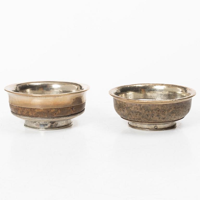 Two Tibetan bowls, low-grade silver and burl-wood, Early 20th century.