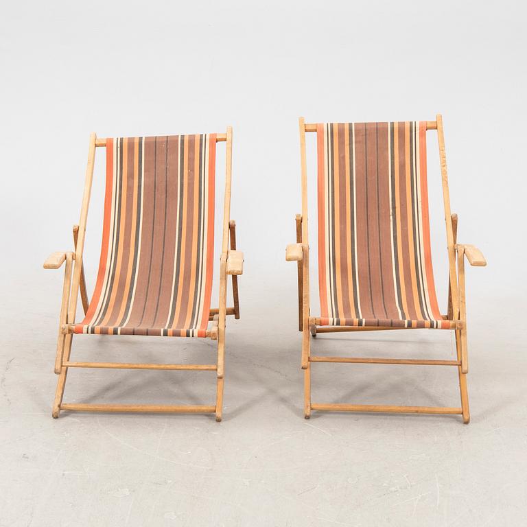 A pair of mid 1900s sun chairs.